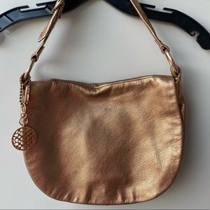Copper COACH leather bag